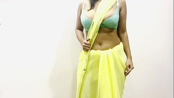 Sultry Indian Bhabhi In Yellow Saree Teases With Her Curves